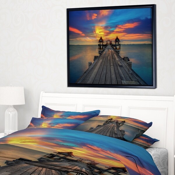 Designart 'Wide Wooden Bridge into Distant Sun' Pier Seascape Framed Canvas Art Print
