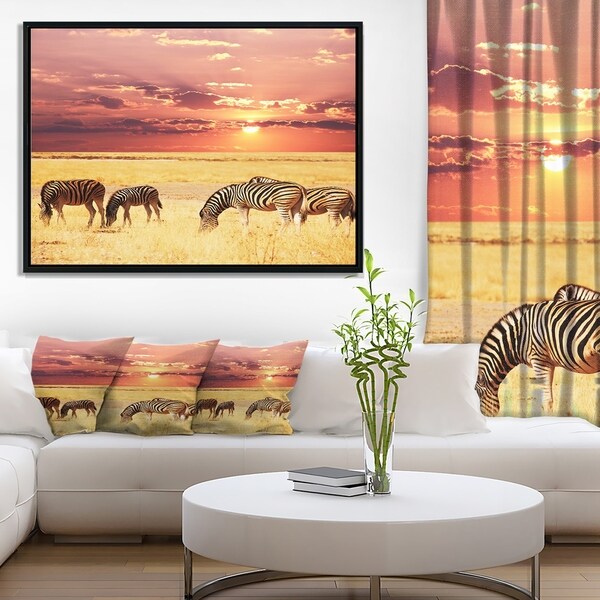 Designart 'Zebras Grazing Together at Sunset' Modern Landscape Wall Art Framed Canvas