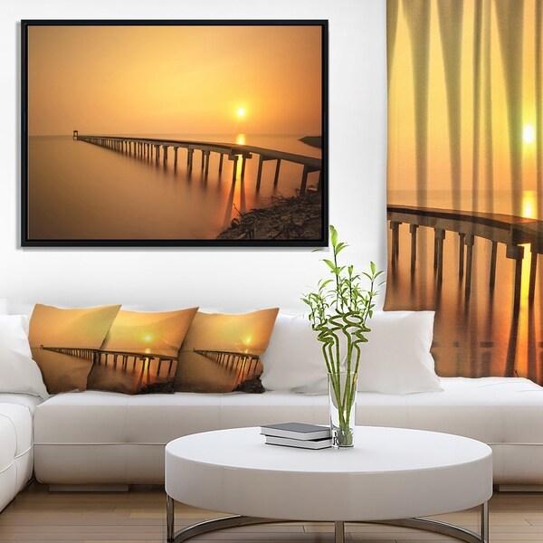 Designart 'Old Wooden Pier Long to Evening Sea' Pier Seascape Framed Canvas Art Print
