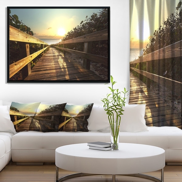 Designart 'Wood Boardwalk into the Sunset Sea' Bridge Framed Canvas Art Print