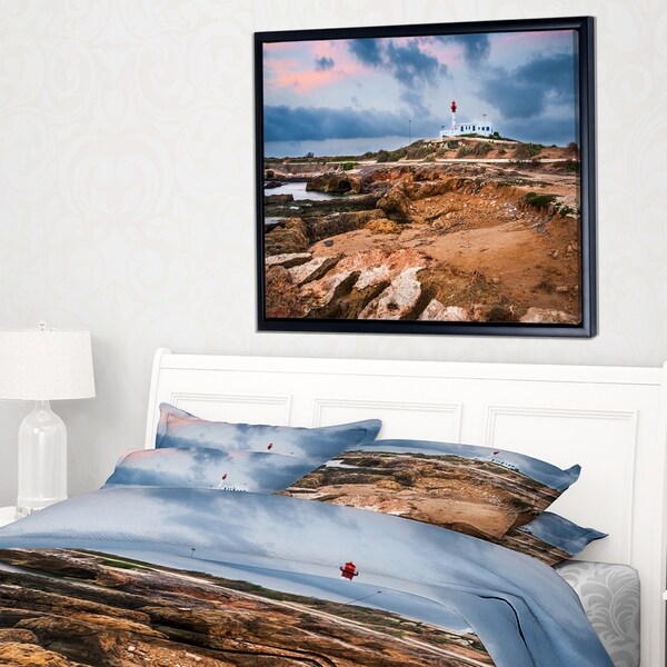 Designart 'Remote Lighthouse on the Rocks' Landscape Framed Canvas Art Print