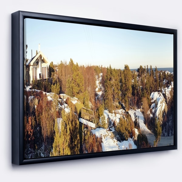 Designart 'Rocky Coast with Wooden Cottage' Landscape Framed Canvas Art Print