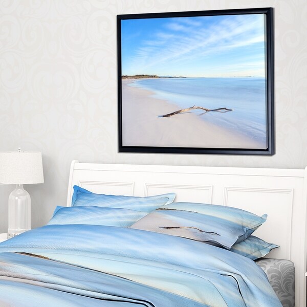 Designart 'Wood Branch on White Beach' Modern Seascape Framed Canvas Artwork