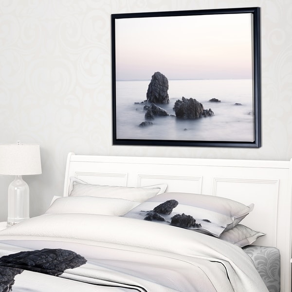 Designart 'Rocks in the Sea Black and White' Seashore Framed Canvas Art Print