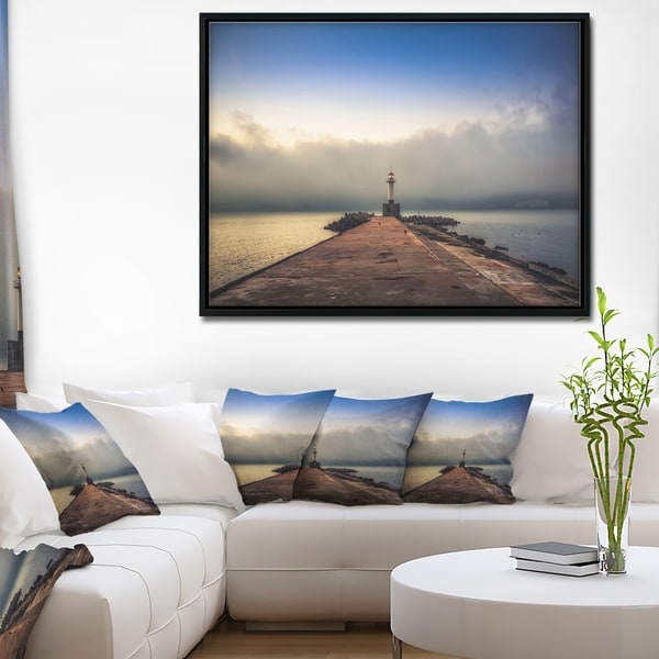 Designart 'Lighthouse on Coast and Cloudy Sky' Modern Framed Canvas Art Print