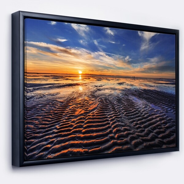 Designart 'Waves On the Sand During Sunset' Seashore Framed Canvas Art Print