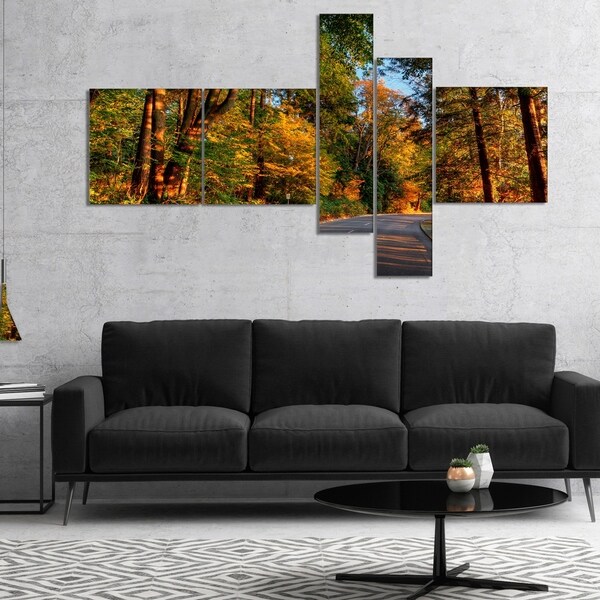 Designart 'Road through Lit up Fall Forest' Landscape Canvas Art