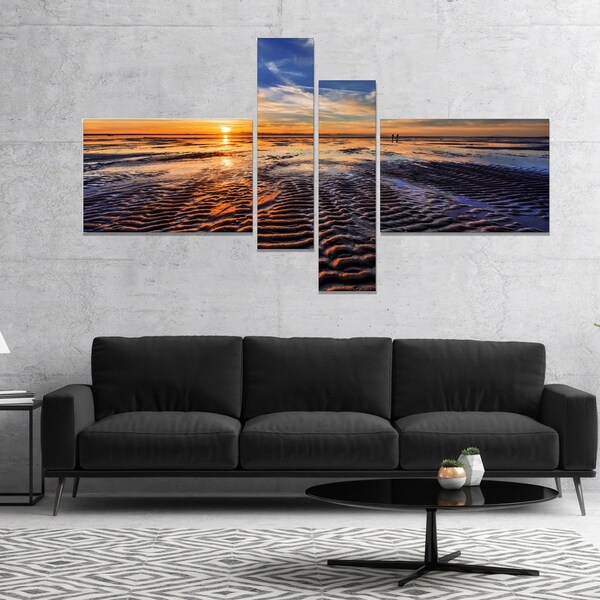 Designart 'Waves On the Sand During Sunset' Seashore Canvas Art Print