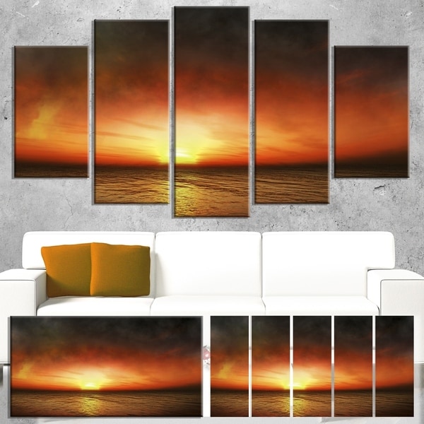Designart 'Fiery Sunset Beach under Cloudy Sky' Modern Seashore Canvas Art