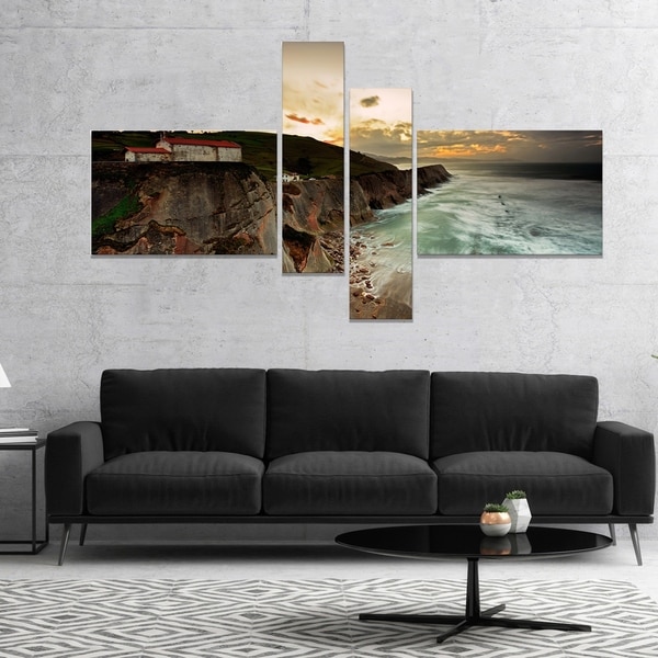 Designart 'Ocean Hitting Rocky Hill' Seashore Photo Canvas Art Print
