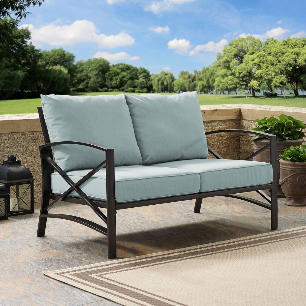 Crosley kaplan loveseat in oiled bronze with mist universal cushion cover