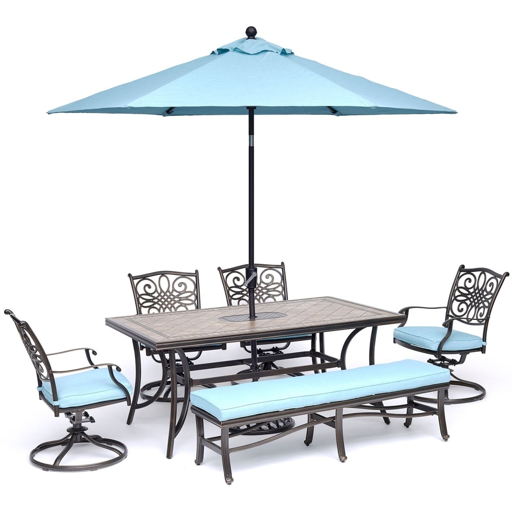 Hanoverhanover Monaco 6 Piece Dining Set In Blue With Swivel Rockers Bench Tile Top Table And Umbrella With Stand Dailymail