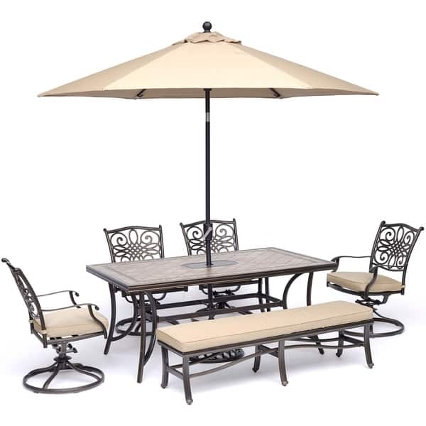 slide 1 of 15, Hanover Monaco 6-Piece Dining Set in Tan with Swivel Rockers, Bench, Tile-Top Table, and Umbrella with Stand