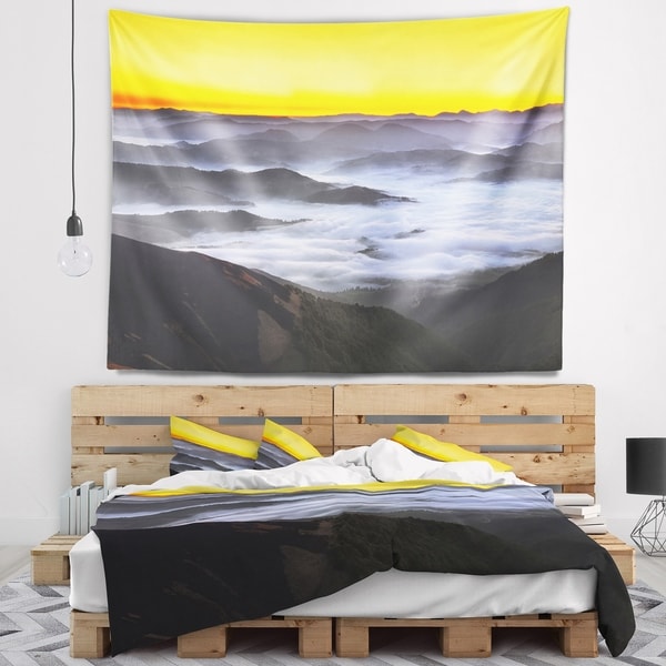 Designart 'Yellow Sky and Foggy Mountains' Landscape Wall Tapestry