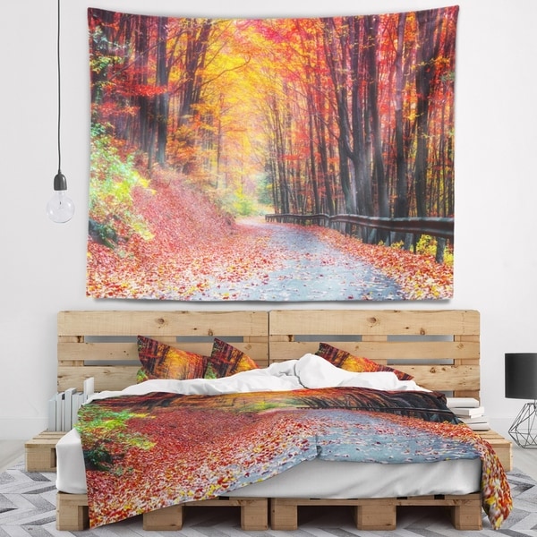 Designart 'Road in Beautiful Autumn Forest' Modern Forest Wall Tapestry