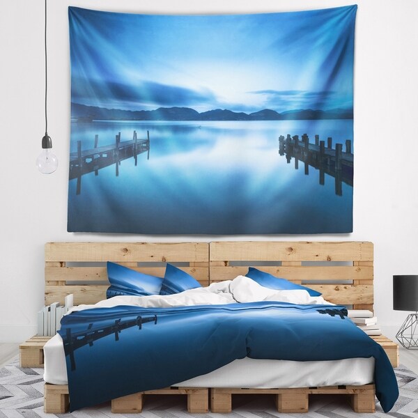 Designart 'Dark Blue Sea and Piers' Seascape Wall Tapestry