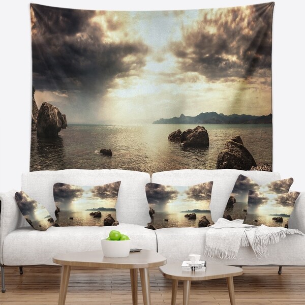 Designart 'Rocky Seashore under Clouds Panorama' Modern Beach Wall Tapestry