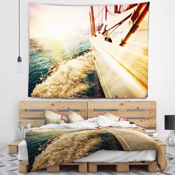 Designart 'Huge Yacht Sailing Against Sunset' Pier Wall Tapestry