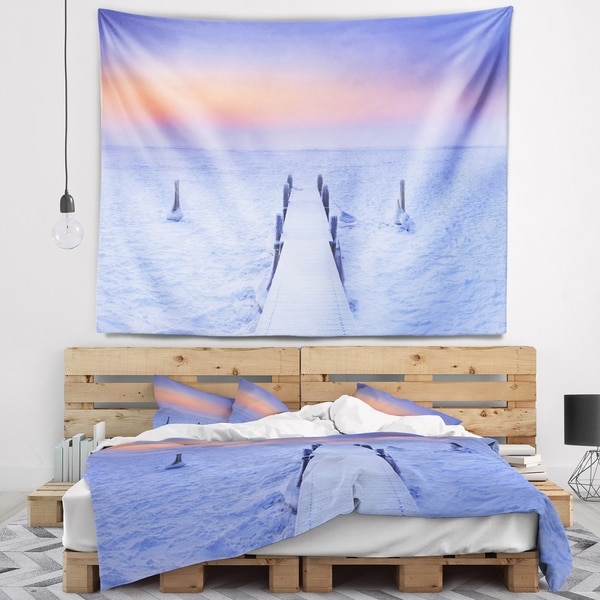 Designart 'Jetty in Frozen Lake Netherlands' Wooden Sea Bridge Wall Tapestry