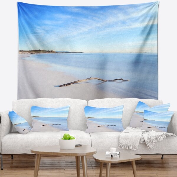 Designart 'Wood Branch on White Beach' Modern Seascape Wall Tapestry