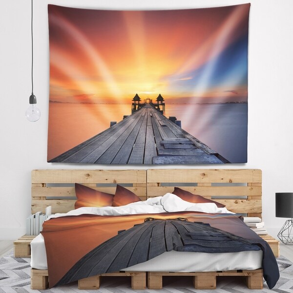 Designart 'Wooden Bridge under Illuminated Sky' Pier Seascape Wall Tapestry