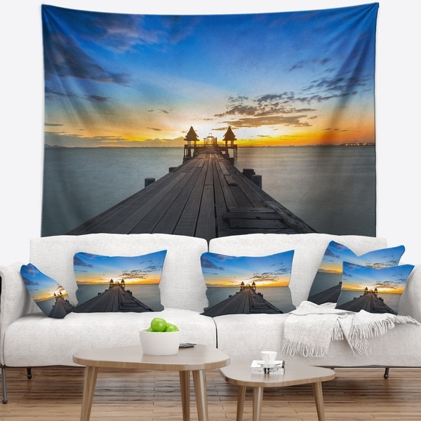 Designart 'Long Wood Pier Leading to Colorful Sea' Sea Bridge Wall Tapestry