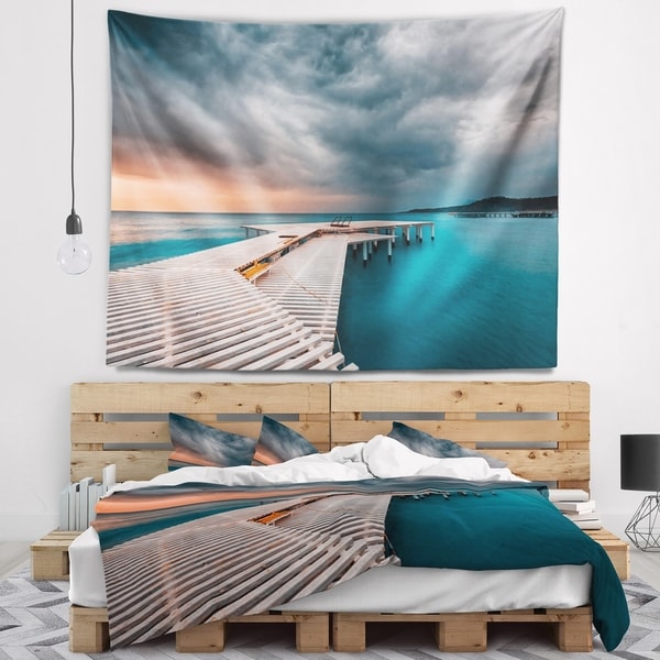 Designart 'Pier in Ocean in Cloudy Day' Seashore Photo Wall Tapestry