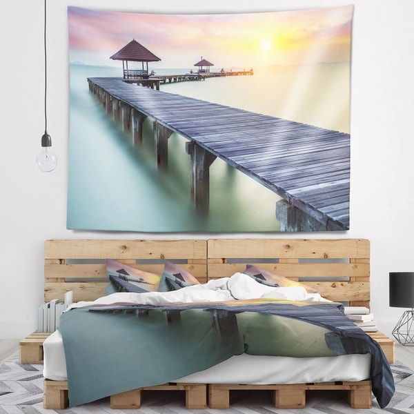 Designart 'Long Wooden Bridge into the Sunrise' Pier Seascape Wall Tapestry