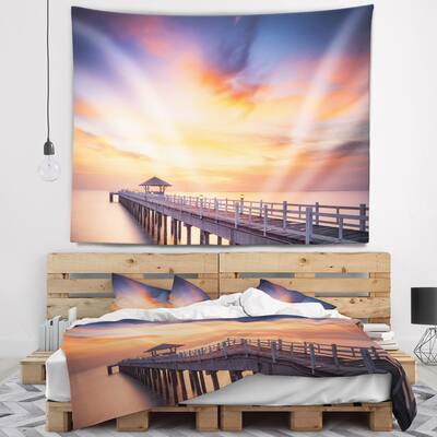 Designart 'Infinite Wooden Bridge under Clouds' Sea Bridge Wall Tapestry