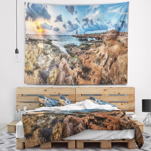 Designart 'Blue Sky over Rough Rocky Coast' Seashore Wall Tapestry
