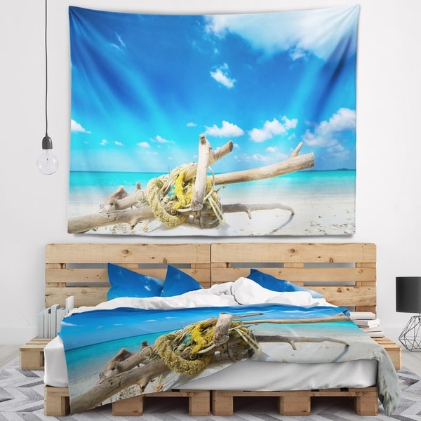 Designart 'Deadwood on White Sand Beach' Seashore Wall Tapestry