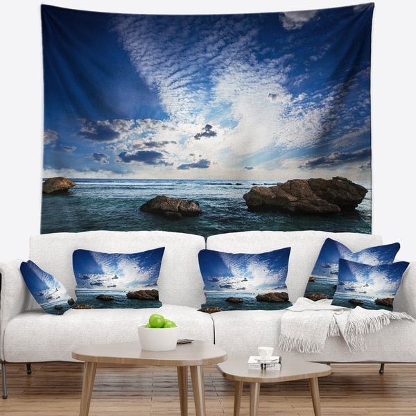 Designart 'Rocky Beach with White Clouds' Modern Beach Wall Tapestry