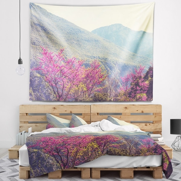 Designart 'Pink Blossoming Flowers in Mountains' Floral Wall Tapestry