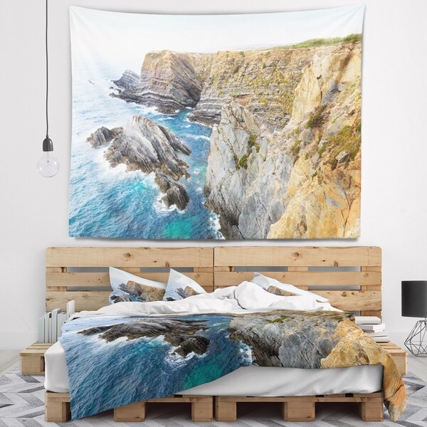 Designart 'Blue Rocky Bay Portugal Panorama' Seashore Wall Tapestry
