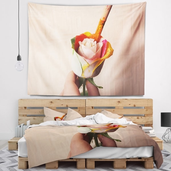 Designart 'Person Painting Beautiful Rose' Floral Wall Tapestry