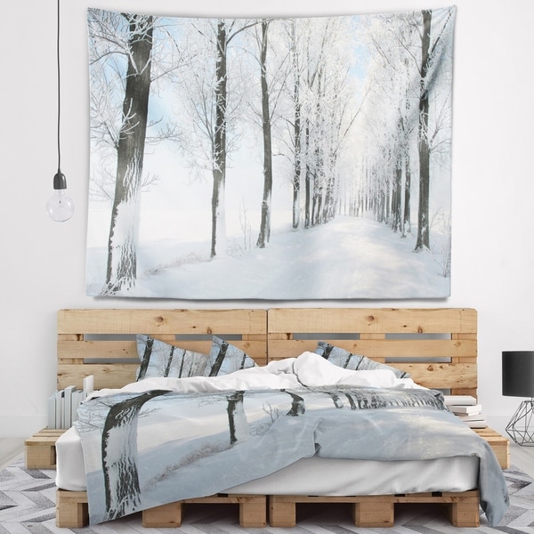 Designart 'Beautiful Winter Forest Lane Photo' Forest Wall Tapestry