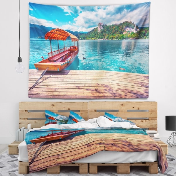 Designart 'Boat in Lake Bled In Julian Alps' Landscape Wall Tapestry