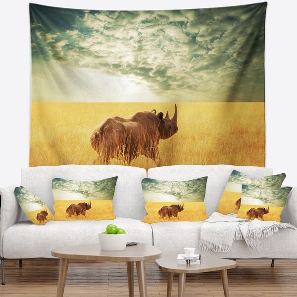 Designart 'Rhino in Grassland under Cloudy Sky' African Wall Tapestry