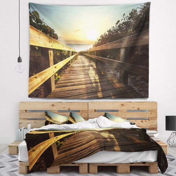 Designart 'Wood Boardwalk into the Sunset Sea' Bridge Wall Tapestry