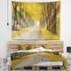 Designart 'Country Road Below Yellow Trees' Landscape Photography Wall ...