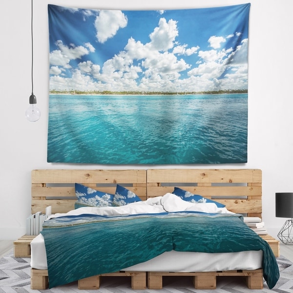Designart 'White Fluffy Clouds Over Sea' Oversized Beach Wall Tapestry