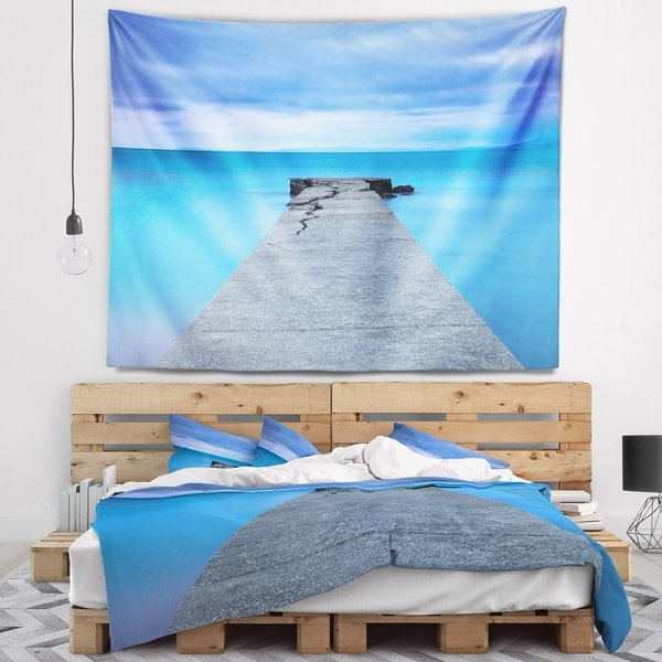 Designart 'Broken Concrete Jetty' Seascape Wall Tapestry