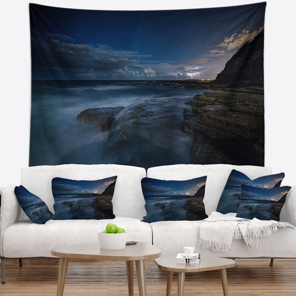 Designart 'Rocky Blue Ocean at Nighttime' Seashore Wall Tapestry