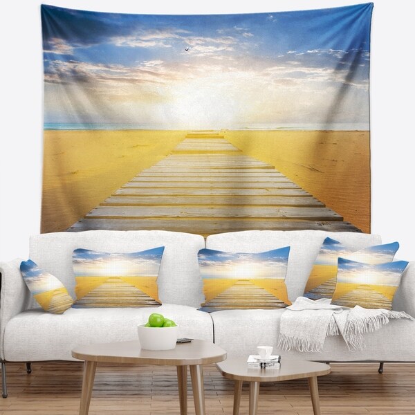 Designart 'Wooden Road at Blue Sea Beach' Sea Bridge Wall Tapestry