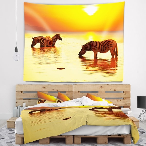 Designart 'Zebras Drinking in Lake at Sunset' Animals Wall Tapestry