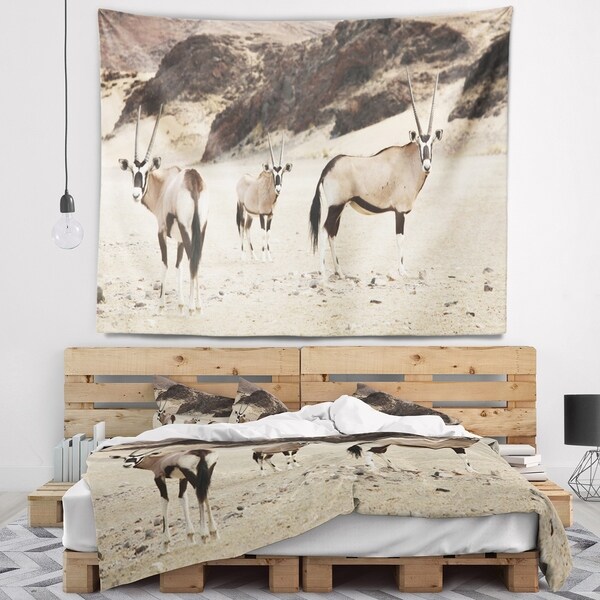 Designart 'Beautiful Wildebeests on Valley' Landscape Wall Tapestry