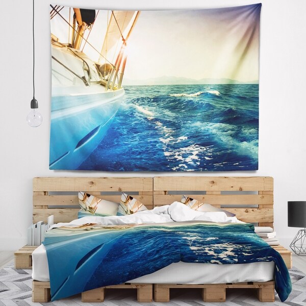 Designart 'Yacht Sailing in Wavy Waters' Seashore Wall Tapestry