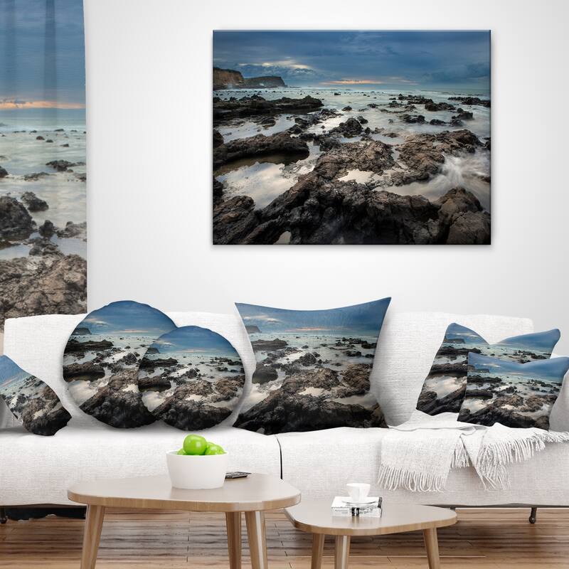 Designart 'Rocky Seashore with Blue Sky Over' Seashore Throw Pillow