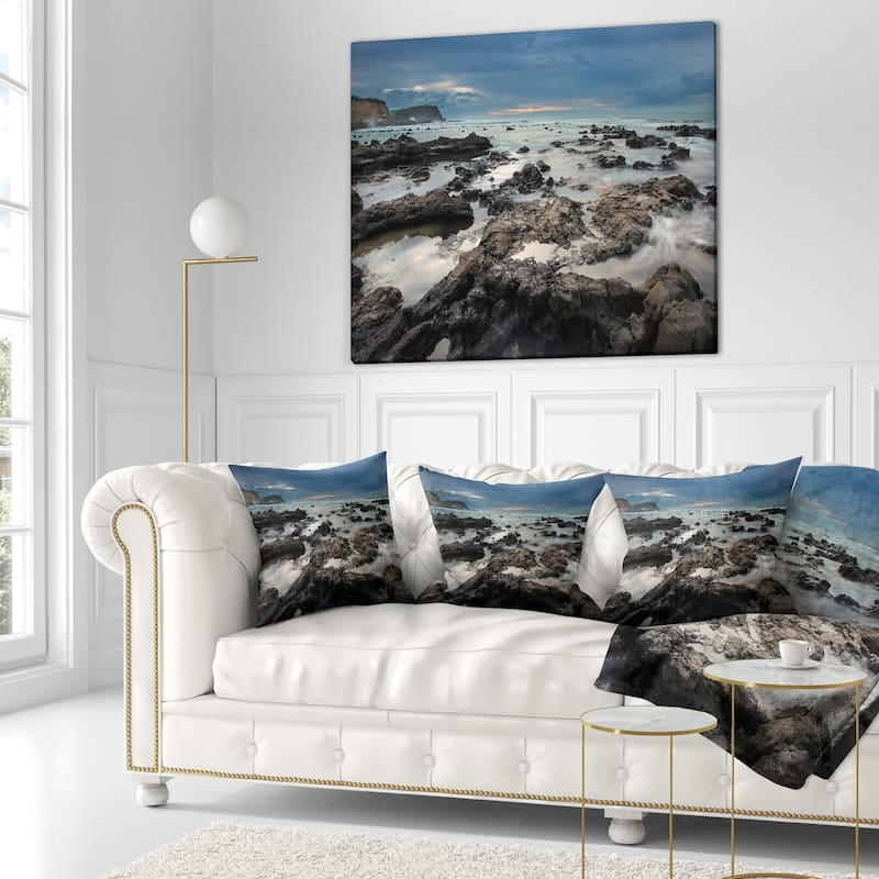 Designart 'Rocky Seashore with Blue Sky Over' Seashore Throw Pillow