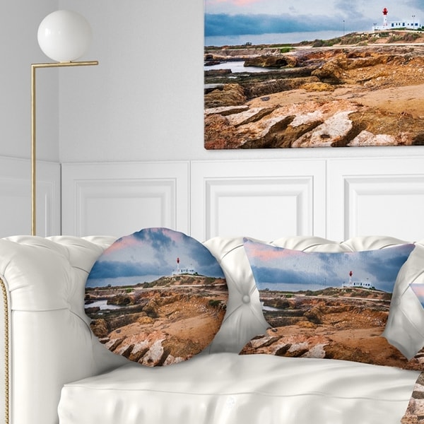 Designart 'Remote Lighthouse on the Rocks' Landscape Printed Throw Pillow